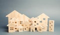 Miniature wooden houses. Real estate. City. Agglomeration and urbanization. Real Estate Market Analytics. Demand for housing. Royalty Free Stock Photo