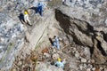 Miniature worker with a hammer working in a quarry Royalty Free Stock Photo
