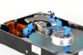 Miniature workers repair hard disk drive