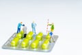 Miniature working with pills medical business concept.