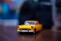 Miniature of a yellow car. extreme closeup