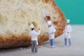 Miniatures of cooks with bread Royalty Free Stock Photo