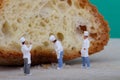 Miniatures of cooks with bread Royalty Free Stock Photo