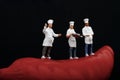 Miniatures of cooks and red hot chili pepper