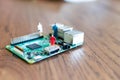 miniatures of people on a green electronic board. Relationship between man and technology, abstract concept with miniature Royalty Free Stock Photo