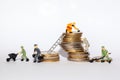 Miniatures on stacks of money Royalty Free Stock Photo