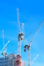 Miniaturised Shot Of Construction Site With Cranes Working On Off