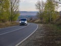 Minibus or minicoach on rual landscape road at sunset Belgorod , Russia - SPT 23, 2020