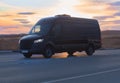 Minibus moves along a country highway