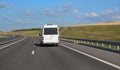 Minibus moves along a suburban highway Royalty Free Stock Photo