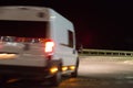 minibus moving on a country highway at night