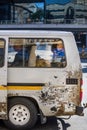 Minibus Taxi with passenger in window.