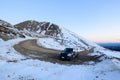 13/8/2019 A Mini cooper Country man climbing to the top of snow hill in South island, New Zealand Royalty Free Stock Photo