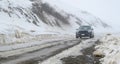 14/8/2019 A Mini cooper Country man climbing to the top of snow hill in South island, New Zealand Royalty Free Stock Photo