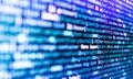 Minificated web development javascript code close up in sunset rays. Web programming and bracket technology background. Royalty Free Stock Photo