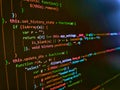 Minificated web development javascript code close up in sunset rays. Programming Coding with editor colorful themes. Lines of Html Royalty Free Stock Photo