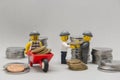 Minifigures of bank robbers stealing money. Thieves carrying coins Royalty Free Stock Photo