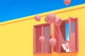Minimal abstract building with pink window and floating balloons on blue sky background, Architectural design with shade and