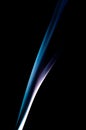 Blue Smoke Trail Forming Smooth Minimal Curve Against Black Background In Abstract Style Royalty Free Stock Photo