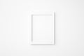 Minimal blank or empty rectangle picture frame hanging on white wall. Mockup background graphic image