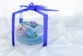 Minimal cake made from pandan Layer Sweet Cake and decorated wite cute flowers in plastic box