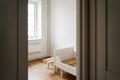 MInimal child room for toddler in white and wooden colors. Less waste lifestyle in parenting Royalty Free Stock Photo