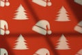 Minimal Christmas wallpaper on texture wall with Santa\'s hat and trees as pattern. Royalty Free Stock Photo