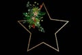 Minimal star shaped Christmas wreath on balck background
