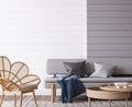 Minimal coastal home design, gray soa on empty white wall