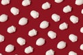 Minimal composition pattern background of white acorns on red background