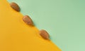 Minimal composition with unshelled Almonds on colorful background