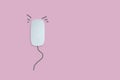 Minimal concept for white computer mouse with lined pattern as a rat on the pink isolate background Royalty Free Stock Photo