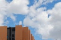 Minimal corner of modern building facade against blue cloudy sky. Minimalistic architecture detail. minimal urban background. Look Royalty Free Stock Photo