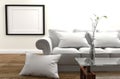 Minimal Design - Modern Living Room with sofa and pillow, vase on glass table, wooden floor and fame on empty white wall Royalty Free Stock Photo