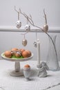Minimal Easter Table Decor with Eggs, Branches and Candle Royalty Free Stock Photo