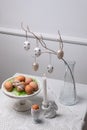 Minimal Easter Table Decor with Eggs, Branches and Candle Royalty Free Stock Photo
