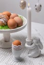 Minimal Easter Table Decor with Eggs, Branches and Candle Royalty Free Stock Photo