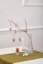 Minimal Easter Table Decor with Eggs, Branches and Candle Royalty Free Stock Photo