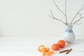 Minimal elegant composition with tangerines and vase