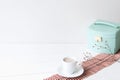 Minimal elegant composition with turquoise box and coffee cup