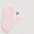 Minimal flat lay composition of massage mitten washcloth and a heart made of violet powder on a white background Royalty Free Stock Photo