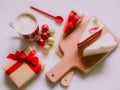 minimal flat lay concept for christmas and new year event by coffee cup ,strawberry and coconut cake on wooden chopping board arr