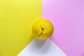 Minimal food concept. Lemon on a bright yellow-pink background. Free space for text. Top view. Minimalism. Creative citrus fruits