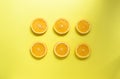 Minimal food concept. Orange fruit on a bright yellow background. Free space for text. Top view. Minimalism. Creative fruits