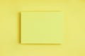 Minimal frame geometric composition mock up. Blank sheet of paper postcard on delicate yellow background. Template design