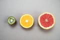 Minimal fruit background. Top view of sliced citrus fruits grap