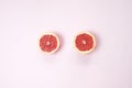 Minimal fruit background. Top view of sliced citrus fruits grape