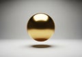 Minimal golden sphere floating abstract background with soft studio lighting Royalty Free Stock Photo