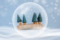 Minimal Happy New Year and Merry Christmas scene with snow, trees and snow globe. For Christmas holiday winter concept Royalty Free Stock Photo