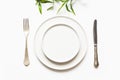 Minimal modern table setting on white. View from above. View from above